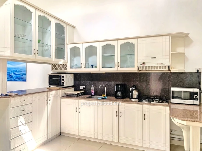 La Gaulette for sale villa divided into 4 two-bedroom apartments with commun swimming pool in a quiet residential area.