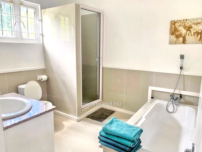La Gaulette for sale villa divided into 4 two-bedroom apartments with commun swimming pool in a quiet residential area.