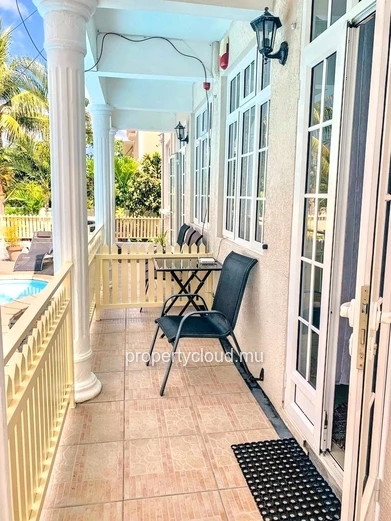 La Gaulette for sale villa divided into 4 two-bedroom apartments with commun swimming pool in a quiet residential area.